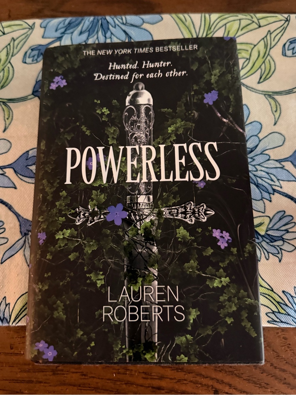 Powerless by Lauren Roberts - Black Cover with Purple Floral Accents